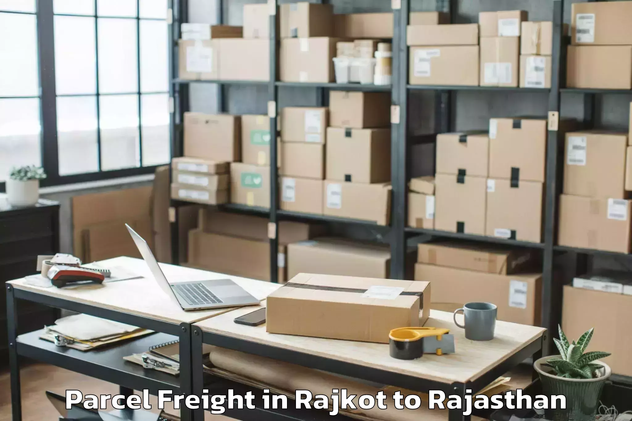 Book Rajkot to Jamwa Ramgarh Parcel Freight